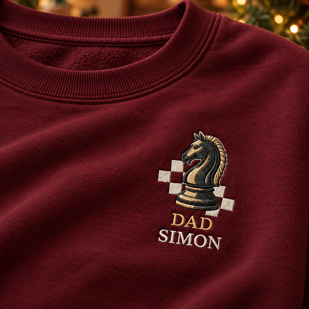 Dad's Chess Move sweatshirt concept mockup featuring a knight chess piece with checkerboard squares, sample personalization SIMON, embroidery view