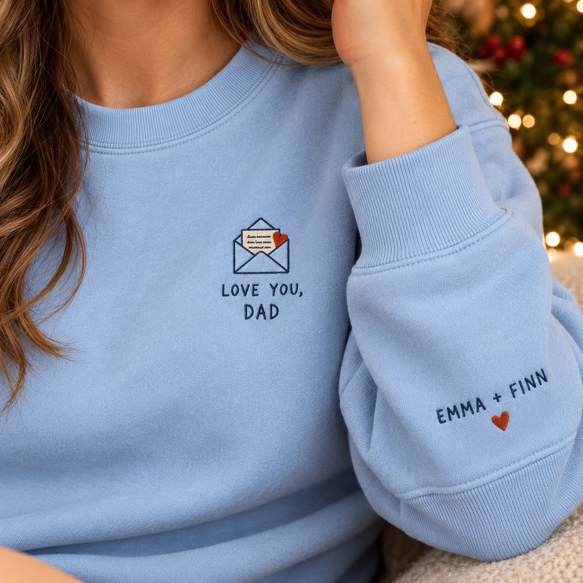Love You Dad Letter sweatshirt concept mockup featuring a love letter in an envelope with a red heart, sample personalization EMMA + FINN, personalization view