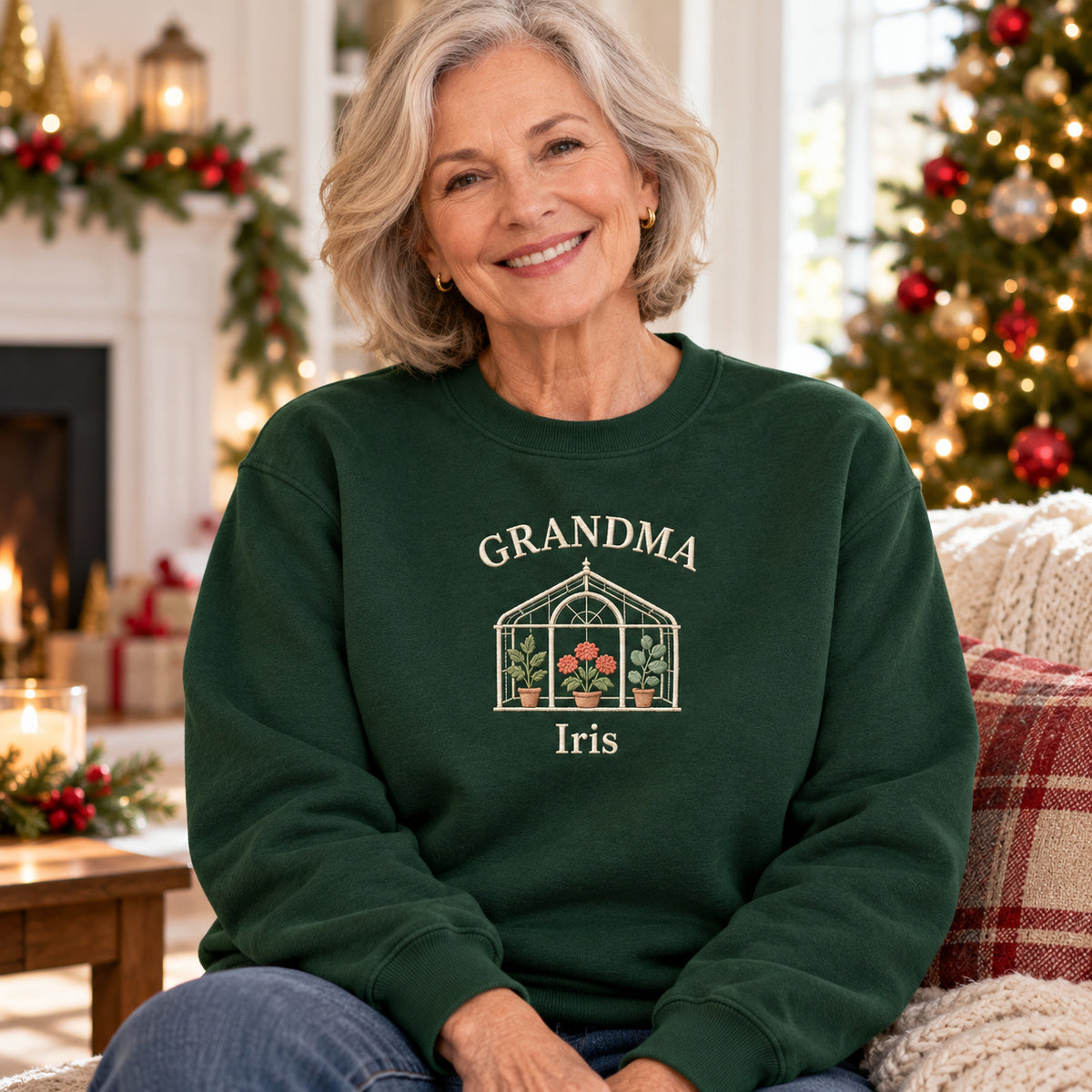 Grandma's Greenhouse sweatshirt concept mockup featuring a greenhouse filled with potted flowers and plants, sample personalization Iris, lifestyle view