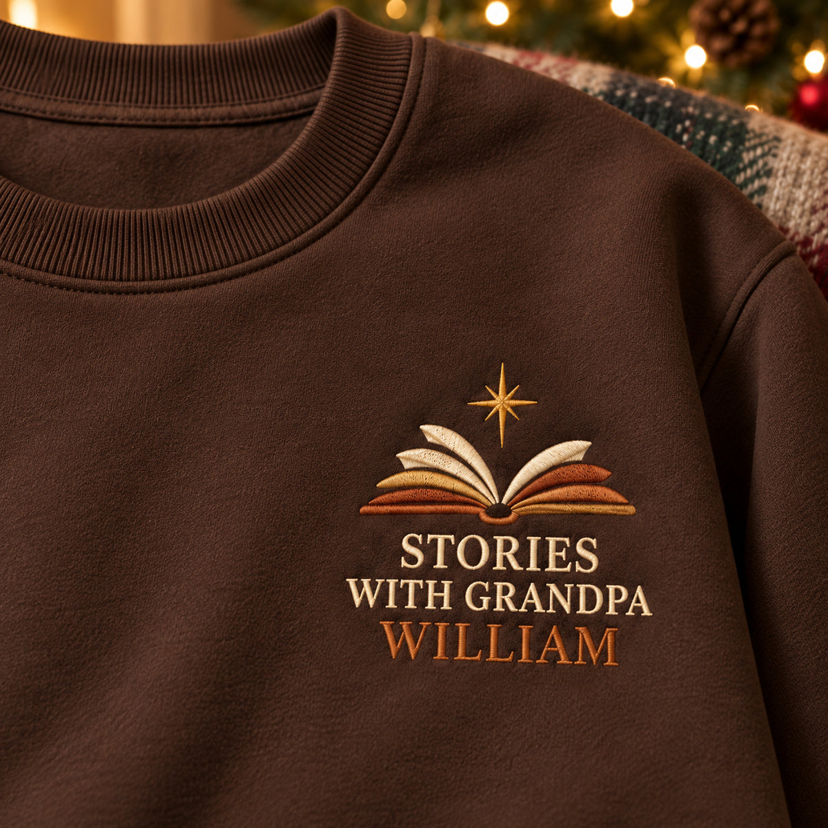 Stories with Grandpa sweatshirt concept mockup featuring an open book with a shining star, sample personalization WILLIAM, embroidery view