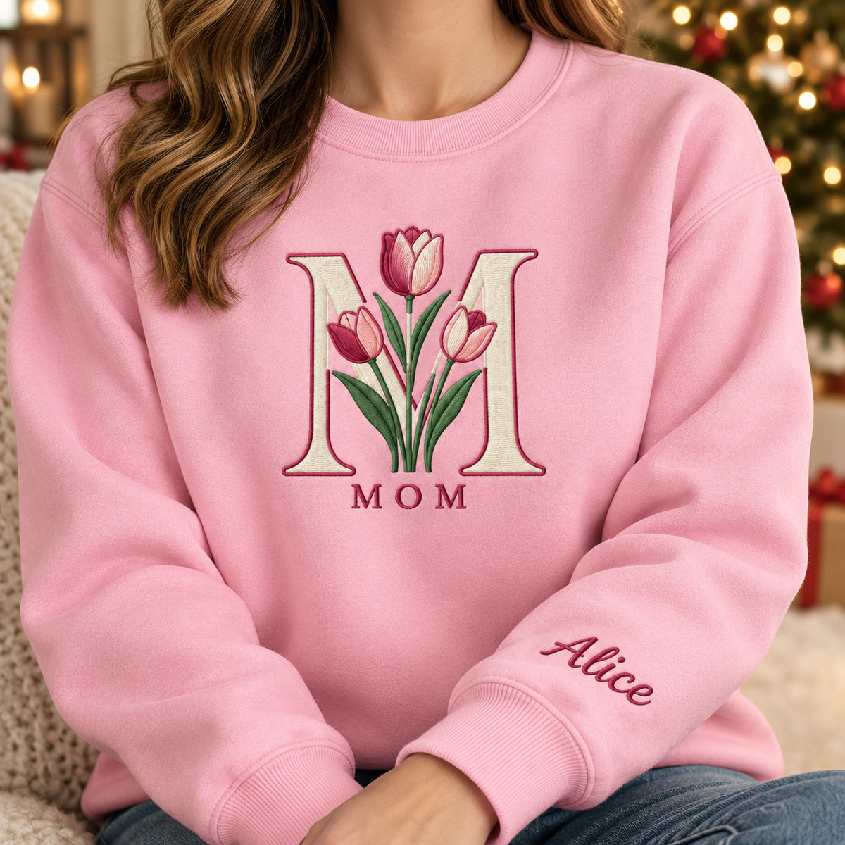 Mom's Tulip sweatshirt concept mockup featuring tulips framed by a large letter M, sample personalization Alice, personalization view