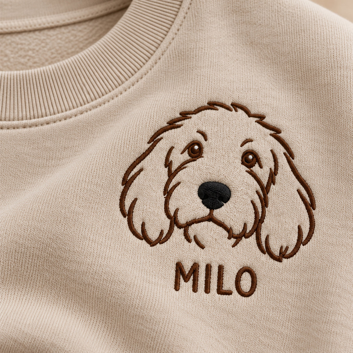 Best Friend Nose sweatshirt concept mockup featuring a shaggy dog's face above a personalized name, sample personalization MILO, personalization view