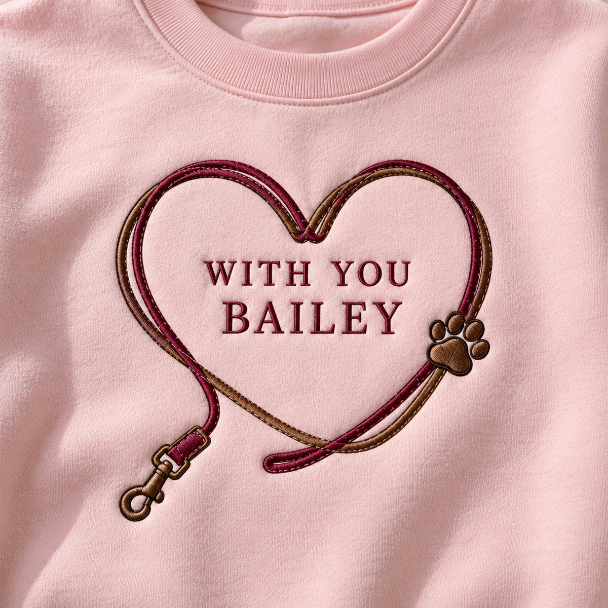 Heart Leash sweatshirt concept mockup featuring a pet leash forming a heart around personalized lettering, sample personalization BAILEY, personalization view