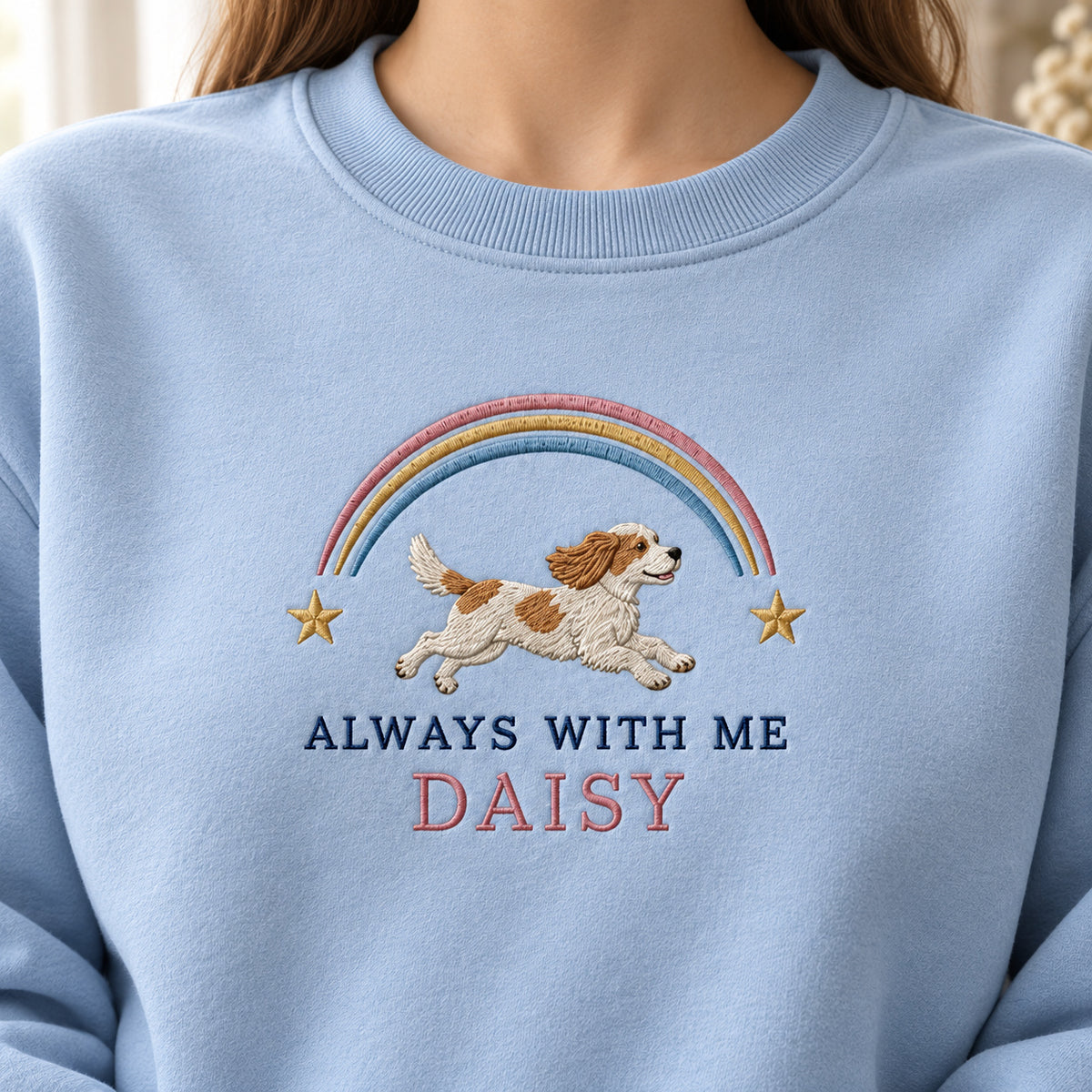 Always with Me sweatshirt concept mockup featuring a running dog beneath a rainbow and stars, sample personalization DAISY, personalization view
