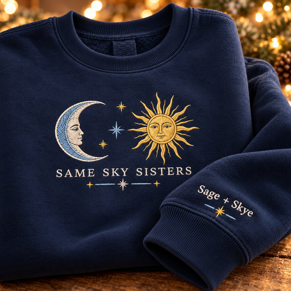 Same Sky Sisters sweatshirt concept mockup featuring a crescent moon, sun and stars, sample personalization Sage + Skye, personalization view