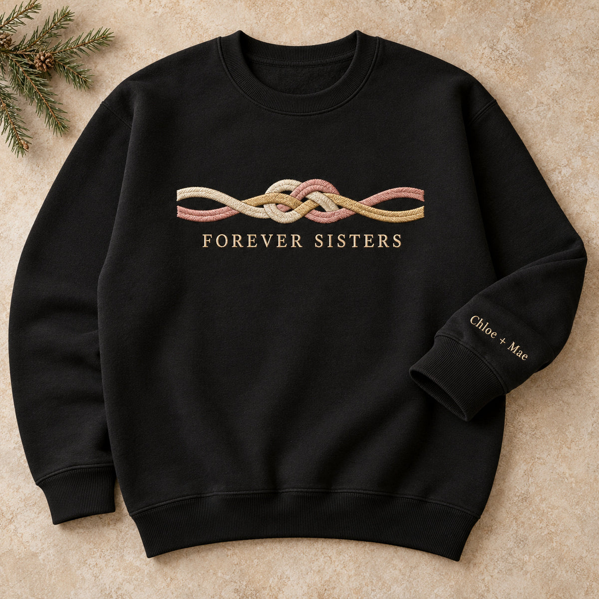 Forever Sisters Knot sweatshirt concept mockup featuring an intertwined friendship knot, sample personalization Chloe + Mae, hero view